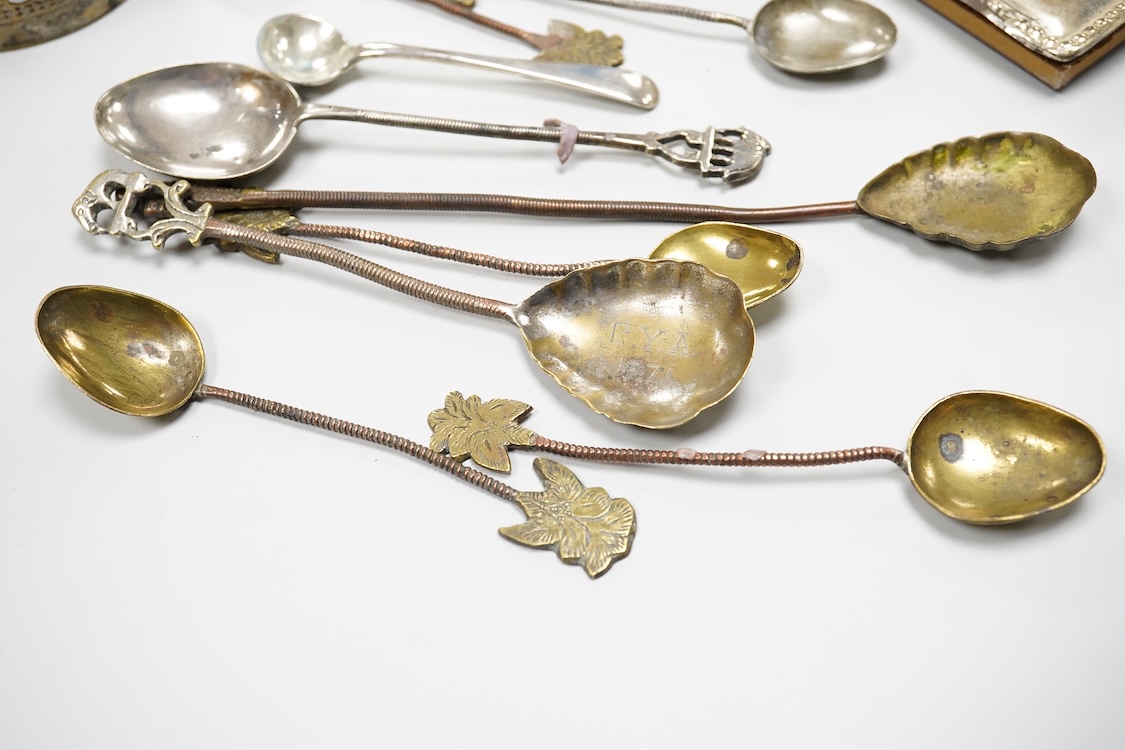 A collection of silver and white metal items, to include a cigarette box, a/f, a German dwarf candlestick, a cased spoon and pusher, etc.